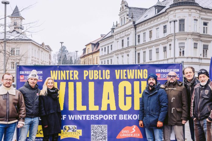 Villachs Stadtmarketing organisiert mit Partnern ein cooles Public-Viewing während der Olympischen Winterspiele: Von links Stadtmarketing-Geschäftsführer Pierre Bechler, Andreas, Lindner (Bundessportzentrum Faaker See), Sandra Staber (Organisation Stadtmarketing), Organisator Marcus Mitzner, „Stern“-Wirt Martin Pohl, Claudio Ghidini mit Fahrenheit-Bandkollegen, die am 13. Februar im Zelt auftreten. Foto: Marta Gillner/Stadtmarketing Villach